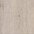 Pale oak Luvanto Dryback Herringbone Tile with fine wood texture. Durable LVT flooring for minimalist and Scandinavian interiors.