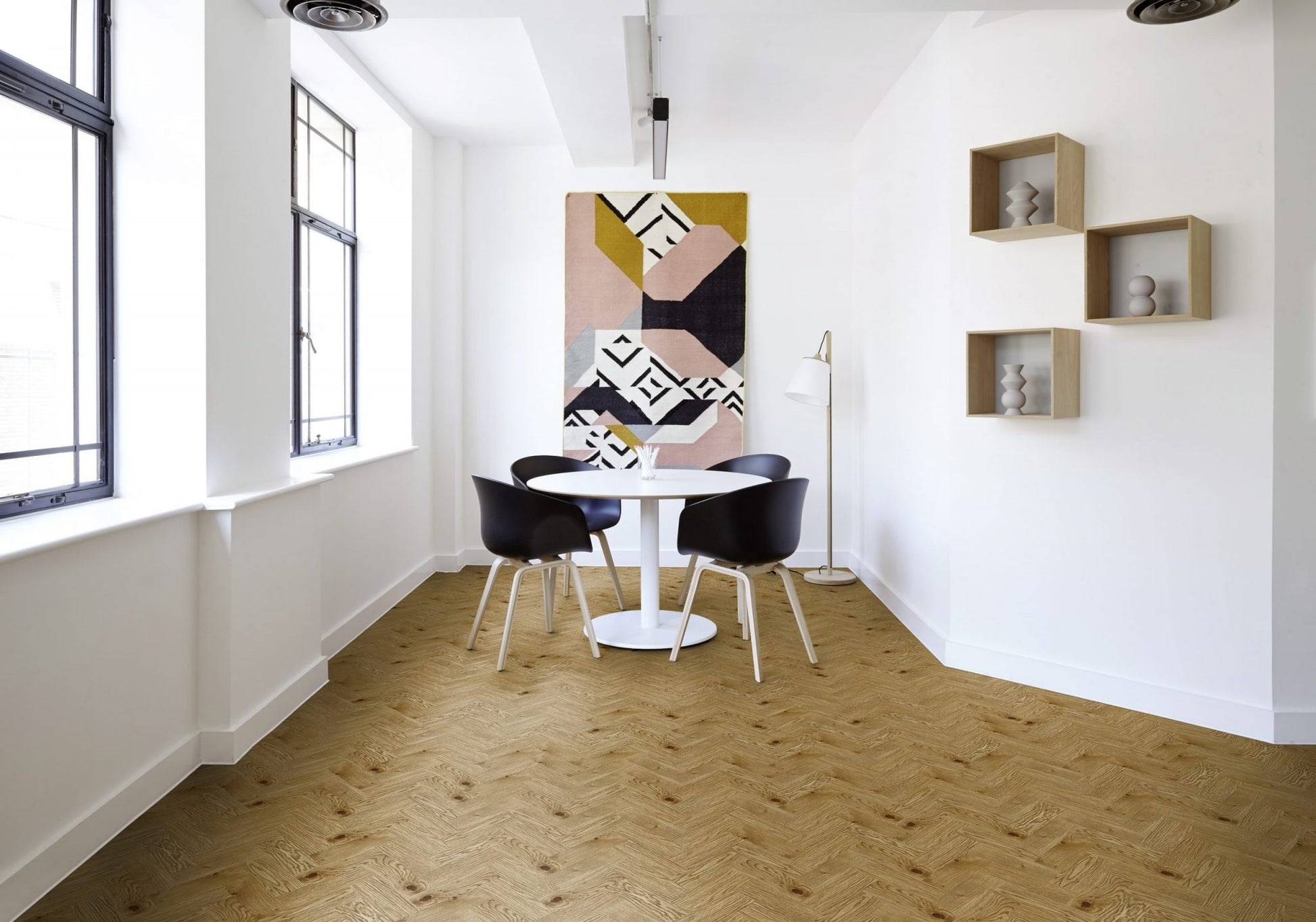 Dining area with Luvanto Dryback Herringbone Flooring in golden oak finish. Durable LVT perfect for modern home design.