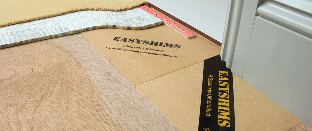 EasyShim Carpet Shims installed under carpet and wood flooring for smooth transition and professional carpet leveling solution.