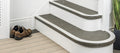 Flexible stair nosing in grey finish installed on curved and straight steps, ideal for modern interiors by Premier Trims.