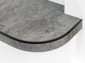 Flexible stair nosing in stone grey finish applied to a curved step, durable and modern by Premier Trims.