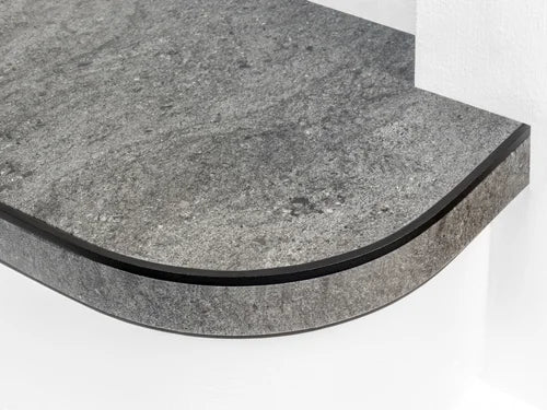 Flexible stair nosing in stone grey finish applied to a curved step, durable and modern by Premier Trims.