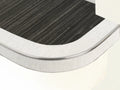 Flexible stair nosing in dark striped finish with white trim, tailored for curved stair applications by Premier Trims.