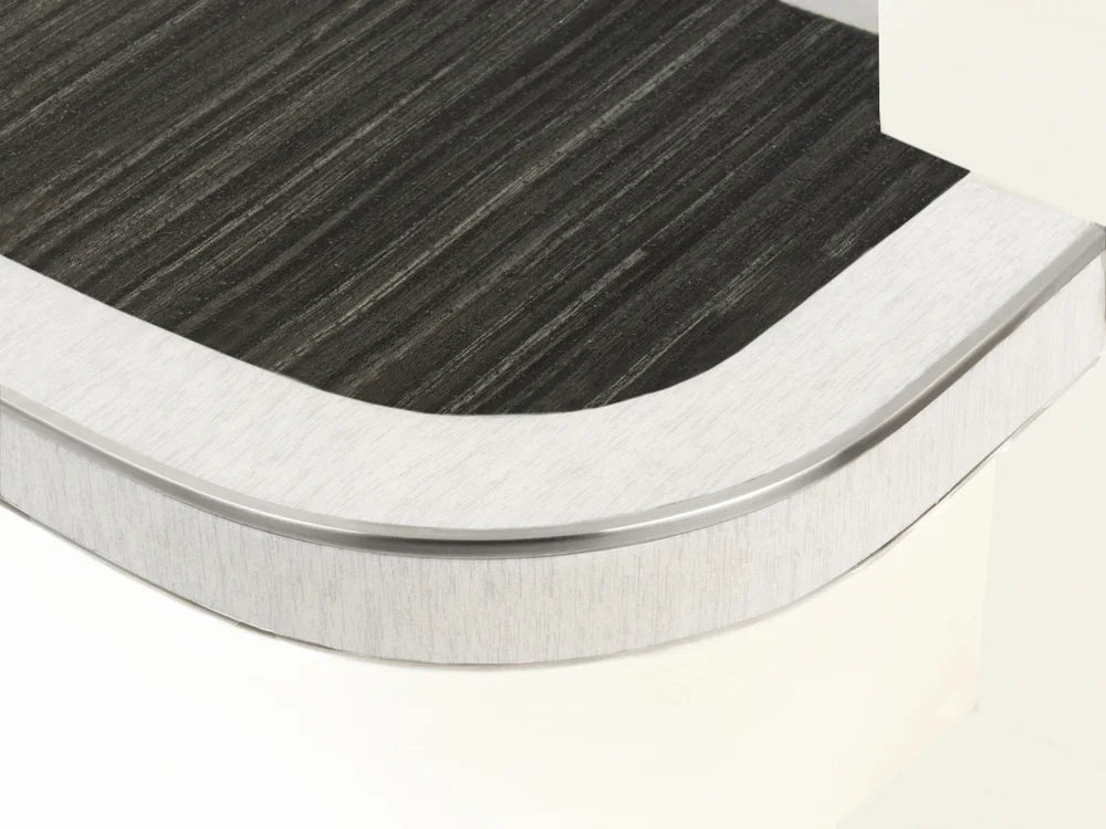 Flexible stair nosing in dark striped finish with white trim, tailored for curved stair applications by Premier Trims.
