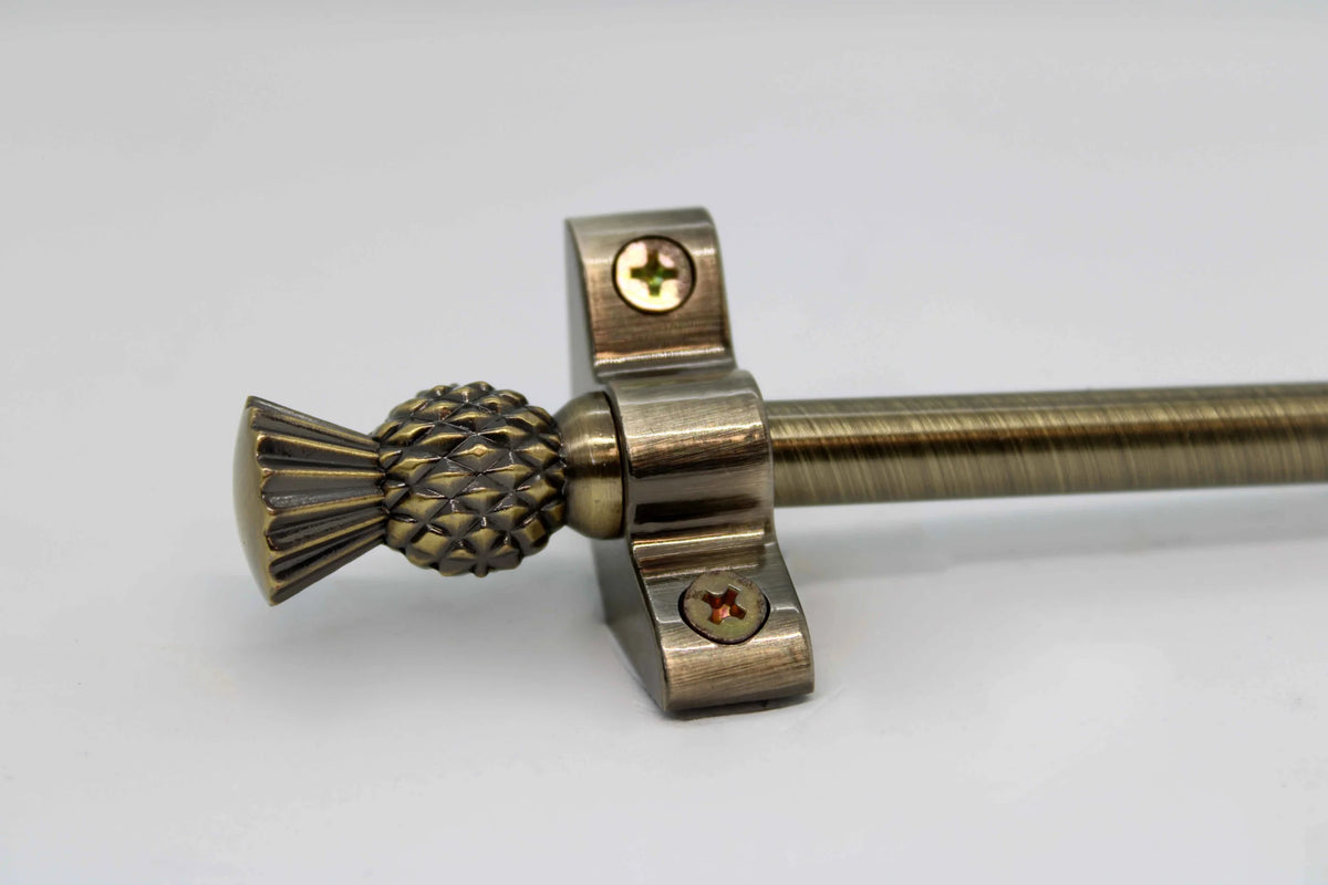 Princes Metal Ashford stair rod — Antique Brass finish with Thistle finial