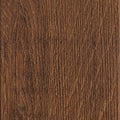 Rich walnut-toned Luvanto Dryback Herringbone Tile with realistic wood finish. Durable LVT for contemporary interiors.