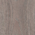 Luvanto Dryback Herringbone Tile in warm brown wood finish, perfect for contemporary hallways and living rooms. Realistic LVT flooring.