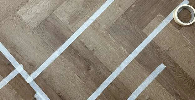 Official Stair Rods UK image showing Geordie Roll LVT tape used during flooring installation.