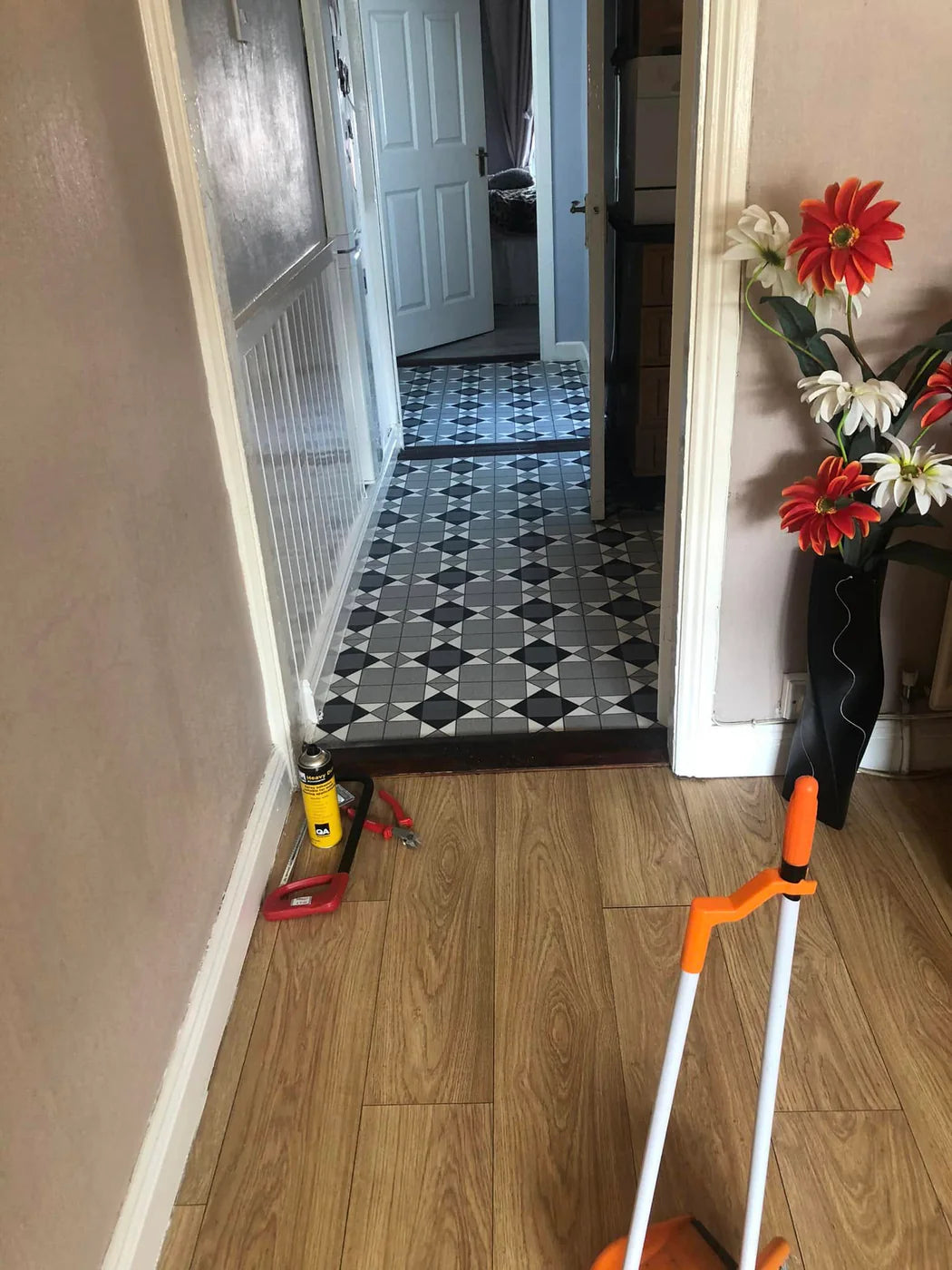 Wood-effect plank flooring fitted through a home hallway