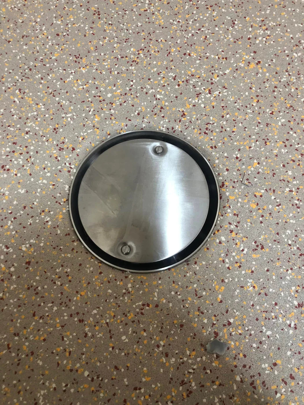 Close-up of professionally fitted resilient flooring around a floor fitting