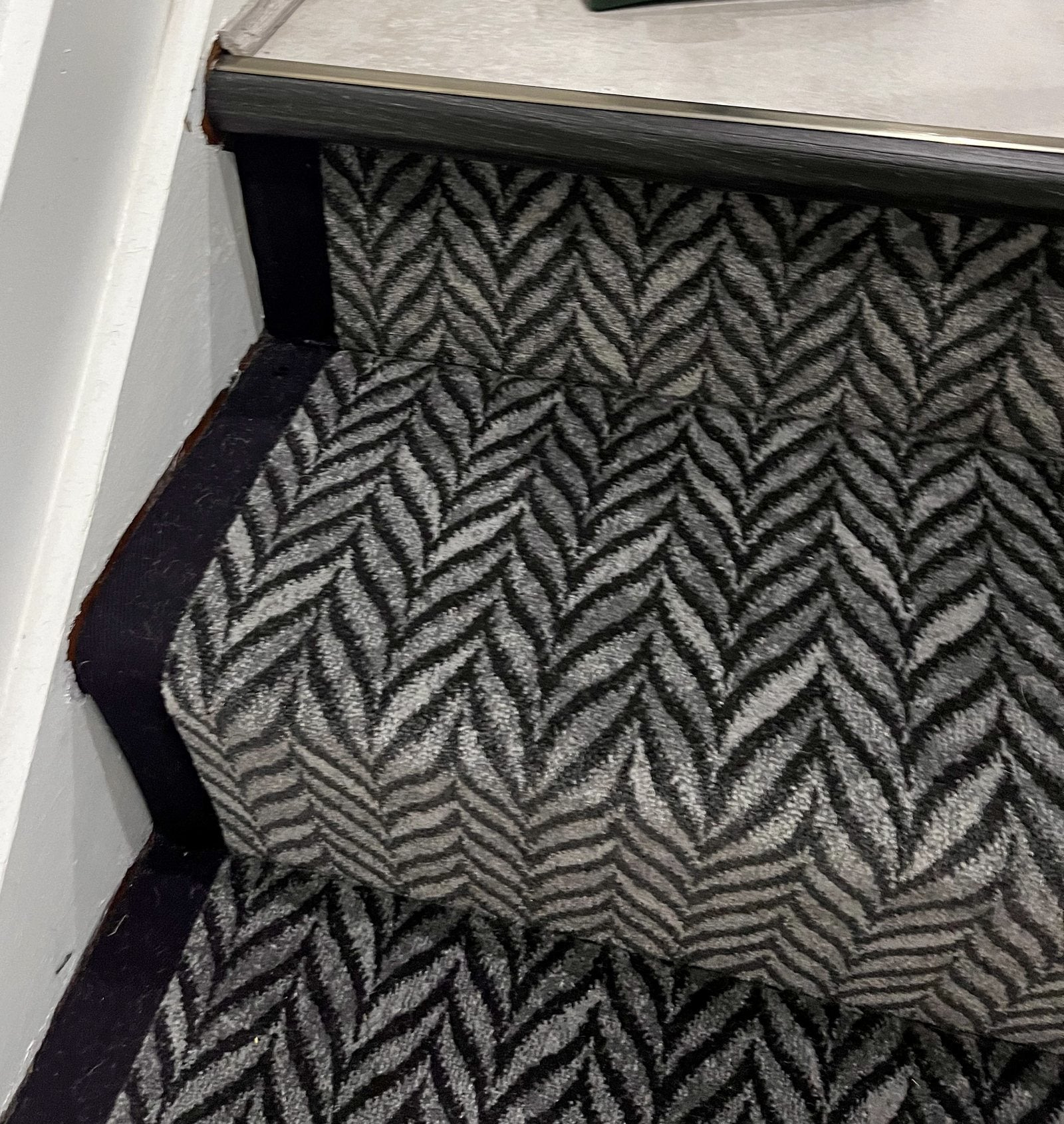 Patterned stair runner close-up with fitted edge detail